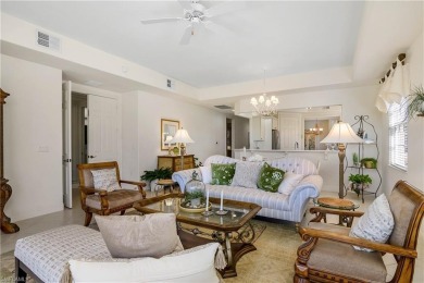 This first floor coach home has a spectacular lake and island on Lely Resort Golf and Country Club in Florida - for sale on GolfHomes.com, golf home, golf lot