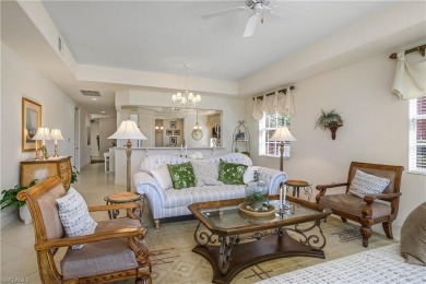 This first floor coach home has a spectacular lake and island on Lely Resort Golf and Country Club in Florida - for sale on GolfHomes.com, golf home, golf lot
