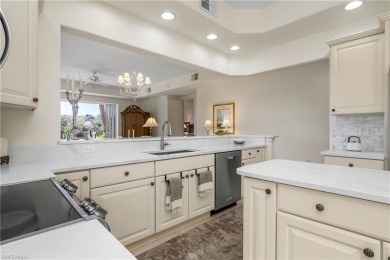 This first floor coach home has a spectacular lake and island on Lely Resort Golf and Country Club in Florida - for sale on GolfHomes.com, golf home, golf lot