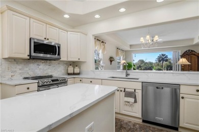 This first floor coach home has a spectacular lake and island on Lely Resort Golf and Country Club in Florida - for sale on GolfHomes.com, golf home, golf lot
