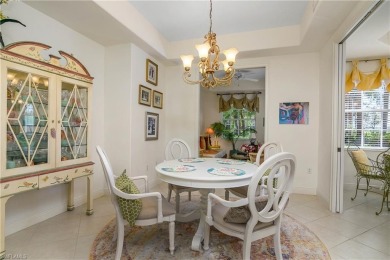 This first floor coach home has a spectacular lake and island on Lely Resort Golf and Country Club in Florida - for sale on GolfHomes.com, golf home, golf lot