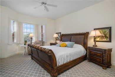 This first floor coach home has a spectacular lake and island on Lely Resort Golf and Country Club in Florida - for sale on GolfHomes.com, golf home, golf lot