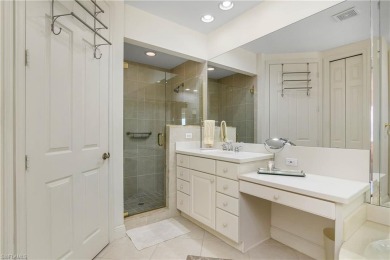 This first floor coach home has a spectacular lake and island on Lely Resort Golf and Country Club in Florida - for sale on GolfHomes.com, golf home, golf lot