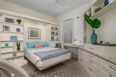 This first floor coach home has a spectacular lake and island on Lely Resort Golf and Country Club in Florida - for sale on GolfHomes.com, golf home, golf lot