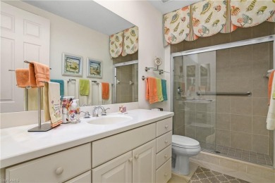 This first floor coach home has a spectacular lake and island on Lely Resort Golf and Country Club in Florida - for sale on GolfHomes.com, golf home, golf lot