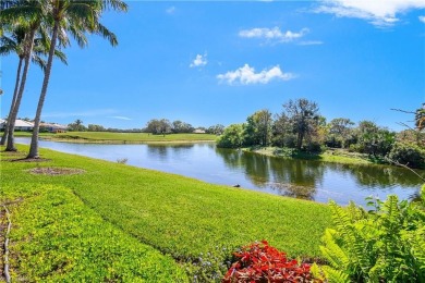 This first floor coach home has a spectacular lake and island on Lely Resort Golf and Country Club in Florida - for sale on GolfHomes.com, golf home, golf lot