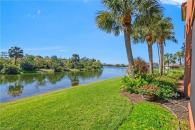 This first floor coach home has a spectacular lake and island on Lely Resort Golf and Country Club in Florida - for sale on GolfHomes.com, golf home, golf lot