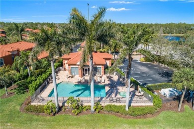 This first floor coach home has a spectacular lake and island on Lely Resort Golf and Country Club in Florida - for sale on GolfHomes.com, golf home, golf lot