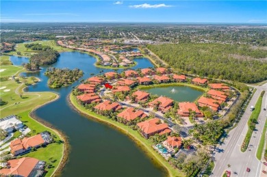 This first floor coach home has a spectacular lake and island on Lely Resort Golf and Country Club in Florida - for sale on GolfHomes.com, golf home, golf lot