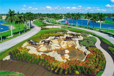This first floor coach home has a spectacular lake and island on Lely Resort Golf and Country Club in Florida - for sale on GolfHomes.com, golf home, golf lot