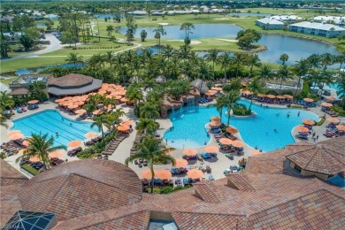 This first floor coach home has a spectacular lake and island on Lely Resort Golf and Country Club in Florida - for sale on GolfHomes.com, golf home, golf lot