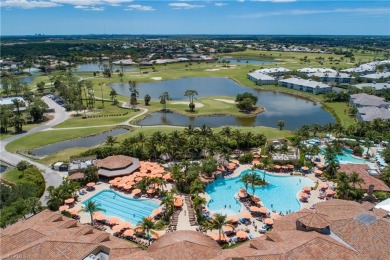 This first floor coach home has a spectacular lake and island on Lely Resort Golf and Country Club in Florida - for sale on GolfHomes.com, golf home, golf lot