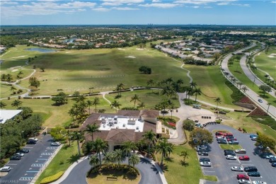 This first floor coach home has a spectacular lake and island on Lely Resort Golf and Country Club in Florida - for sale on GolfHomes.com, golf home, golf lot