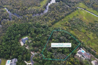 JUST STEPS TO THE WACCAMAW RIVER and a short bike ride to the on The Reserve Golf Club at Pawleys Island in South Carolina - for sale on GolfHomes.com, golf home, golf lot