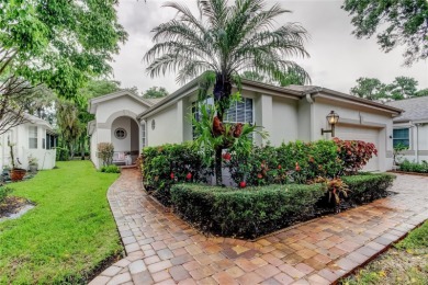 SPECTACULAR SETTING overlooking the Westchase Golf Course with on Westchase Golf Club in Florida - for sale on GolfHomes.com, golf home, golf lot