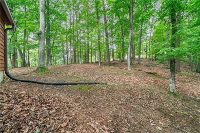 A Tranquil Woodland Escape in Lake Arrowhead awaits the lucky on The Highlands Course at Lake Arrowhead in Georgia - for sale on GolfHomes.com, golf home, golf lot