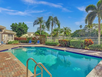 Located in Oxford Estates in posh Boca Raton, this small gated on Boca Lago Golf and Country Club in Florida - for sale on GolfHomes.com, golf home, golf lot