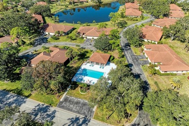 This showstopper CARRIAGE HOME is truly one of a kind, featuring on Palm Aire Country Club of Sarasota in Florida - for sale on GolfHomes.com, golf home, golf lot