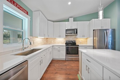 Constructed in 2021, this MODERN-STYLE residence in Rotonda West on Rotonda Golf and Country Club The Palms Course in Florida - for sale on GolfHomes.com, golf home, golf lot