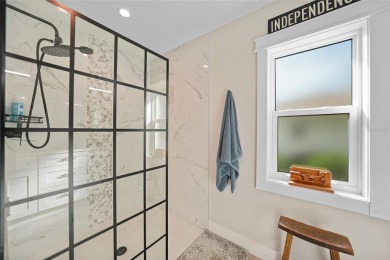 Constructed in 2021, this MODERN-STYLE residence in Rotonda West on Rotonda Golf and Country Club The Palms Course in Florida - for sale on GolfHomes.com, golf home, golf lot