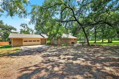Perched on the tee box of the 14th hole of the beautiful Lake on Lake Kiowa Golf Course in Texas - for sale on GolfHomes.com, golf home, golf lot