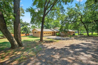 Perched on the tee box of the 14th hole of the beautiful Lake on Lake Kiowa Golf Course in Texas - for sale on GolfHomes.com, golf home, golf lot