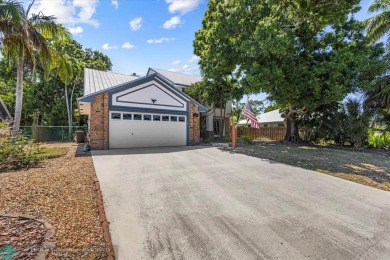You'll love coming home to this hidden gem on Sailfish Sands on Martin County Golf Course in Florida - for sale on GolfHomes.com, golf home, golf lot