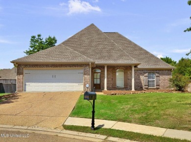 This 4 bedroom, 2 bath home is full of charm and space for the on Lake Caroline Golf Club in Mississippi - for sale on GolfHomes.com, golf home, golf lot