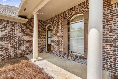 This 4 bedroom, 2 bath home is full of charm and space for the on Lake Caroline Golf Club in Mississippi - for sale on GolfHomes.com, golf home, golf lot