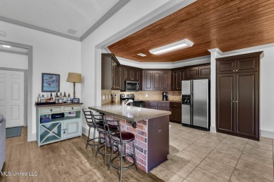 This 4 bedroom, 2 bath home is full of charm and space for the on Lake Caroline Golf Club in Mississippi - for sale on GolfHomes.com, golf home, golf lot