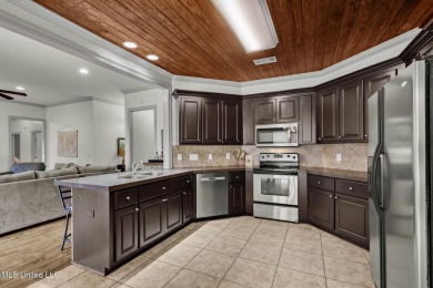 This 4 bedroom, 2 bath home is full of charm and space for the on Lake Caroline Golf Club in Mississippi - for sale on GolfHomes.com, golf home, golf lot