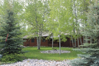Corner lot, in the trees. Full finished basement with 2 bedrooms on Aspen Hills Golf Course in Wyoming - for sale on GolfHomes.com, golf home, golf lot