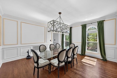 Discover timeless elegance and golf course living in this on Woodside Plantation Country Club in South Carolina - for sale on GolfHomes.com, golf home, golf lot