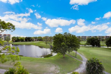 GOLF & WATER VIEWS FROM A 23' LONG BALCONY! UPDATED KITCHEN on Poinciana Golf Club in Florida - for sale on GolfHomes.com, golf home, golf lot