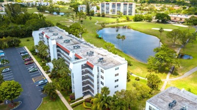 GOLF & WATER VIEWS FROM A 23' LONG BALCONY! UPDATED KITCHEN on Poinciana Golf Club in Florida - for sale on GolfHomes.com, golf home, golf lot