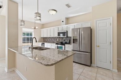 Welcome to this beautifully maintained 3-bedroom, 2-bathroom on Wildwood Country Club in Florida - for sale on GolfHomes.com, golf home, golf lot