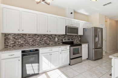 Welcome to this beautifully maintained 3-bedroom, 2-bathroom on Wildwood Country Club in Florida - for sale on GolfHomes.com, golf home, golf lot