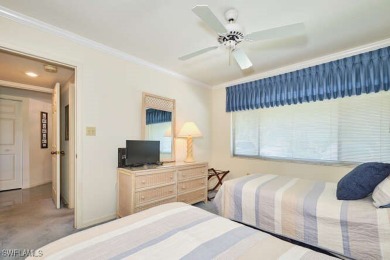 You are just steps to the inviting community pool from this on Fiddlesticks Country Club in Florida - for sale on GolfHomes.com, golf home, golf lot