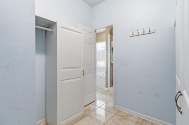 Welcome to this beautifully maintained 3-bedroom, 2-bathroom on Wildwood Country Club in Florida - for sale on GolfHomes.com, golf home, golf lot