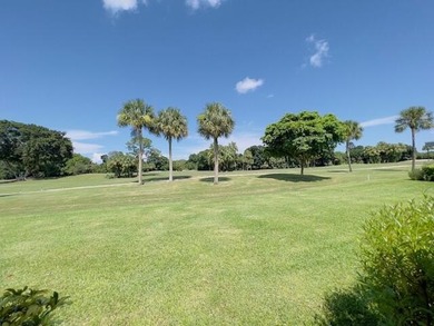 2 bedroom, 2.5 baths, overlooking golf course, tile floors on  in Florida - for sale on GolfHomes.com, golf home, golf lot