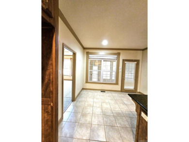 Nice all-brick home with vinyl accents located on Magellan Golf on Magellan Golf Course in Arkansas - for sale on GolfHomes.com, golf home, golf lot