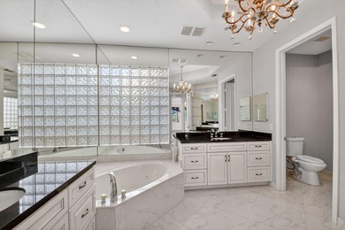 Located on an exceptional corner lot, this magnificent BAYVIEW on Wycliffe Golf and Country Club in Florida - for sale on GolfHomes.com, golf home, golf lot