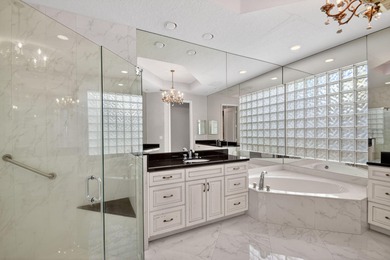 Located on an exceptional corner lot, this magnificent BAYVIEW on Wycliffe Golf and Country Club in Florida - for sale on GolfHomes.com, golf home, golf lot