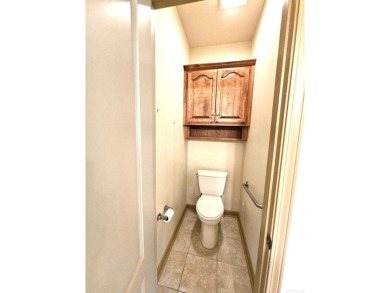 Nice all-brick home with vinyl accents located on Magellan Golf on Magellan Golf Course in Arkansas - for sale on GolfHomes.com, golf home, golf lot
