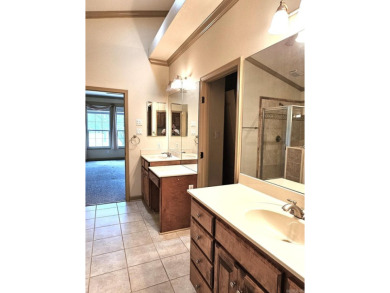 Nice all-brick home with vinyl accents located on Magellan Golf on Magellan Golf Course in Arkansas - for sale on GolfHomes.com, golf home, golf lot