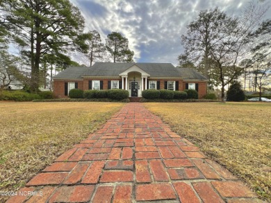Classic Southern charm and elegance combine with a great on Kinston Country Club Inc in North Carolina - for sale on GolfHomes.com, golf home, golf lot