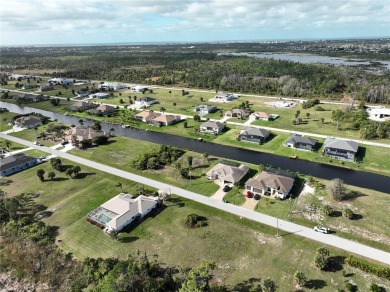 A cleared residential building lot backing up to the 1st Tee Box on Rotonda Golf and Country Club - Long Marsh  in Florida - for sale on GolfHomes.com, golf home, golf lot