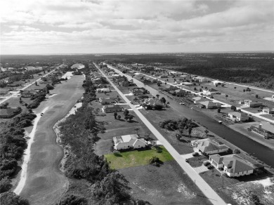 A cleared residential building lot backing up to the 1st Tee Box on Rotonda Golf and Country Club - Long Marsh  in Florida - for sale on GolfHomes.com, golf home, golf lot