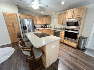 Absolutely stunning 2-bd, 2-ba home with modern updates & a on Del Tura Golf and Country Club in Florida - for sale on GolfHomes.com, golf home, golf lot