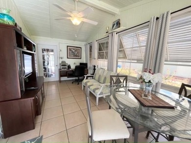 Absolutely stunning 2-bd, 2-ba home with modern updates & a on Del Tura Golf and Country Club in Florida - for sale on GolfHomes.com, golf home, golf lot